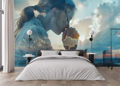 Religion. Double exposure of sky and Christian woman praying over Bible at table, closeup Wall mural