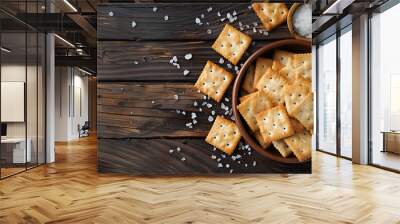 Salty cracker and sea salt in a pot on a dark wooden background Wall mural