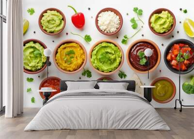 Set of guacamole and different sauces on white background, top view Wall mural