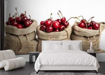 Set of ripe red cherries in burlap sacks on white background Wall mural