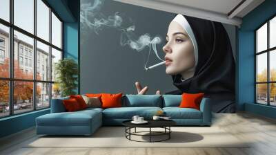 Woman in nun habit smoking cigarette on grey background Wall mural