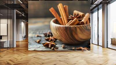 Wooden bowl with cinnamon sticks and anise on table Wall mural