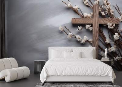 wooden Christian cross, dry plant branches with thorns and leaves on grey snowy background top view Wall mural