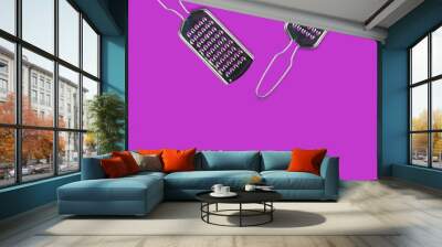 Pair of glossy metallic rectangular sharp graters for different foodstuff on purple table on kitchen with copy space for your text. Top view. Cooking concept Wall mural