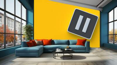 Pause button on yellow background. Listen to music. Watch the video. Control interface for multimedia device. Audio player. Top view. Copy space. 3d render Wall mural