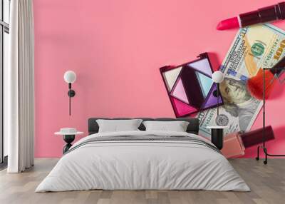 Various cosmetics accessories and banknote of 100 dollars on pink background. Concept of cost of beauty Wall mural