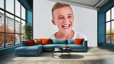 Cute boy on a gray background Wall mural