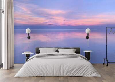 Beautiful lilac sky sunset over water.  Wall mural