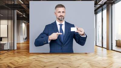 confident businessman man in suit pointing finger on business card for copy space, contact me Wall mural