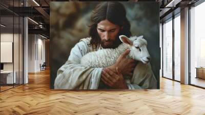 Jesus Christ tenderly holding newborn white lamb with a feeling of protection and care. Wall mural