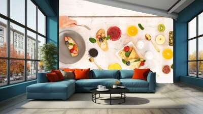 A table with various fruits and sweet desserts. Top view of eating Wall mural