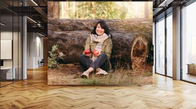 Beautiful and happy carefree forty year old woman outdoors thinking about healthy eating Wall mural