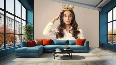 Portrait of arrogance woman with golden crown on head, leadership and success. Attractive rich arrogant girl wearing crown isolated over gray background. Wall mural