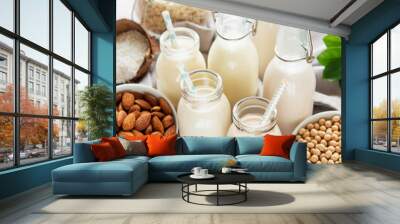 Alternative types of vegan milks in glass bottles Wall mural