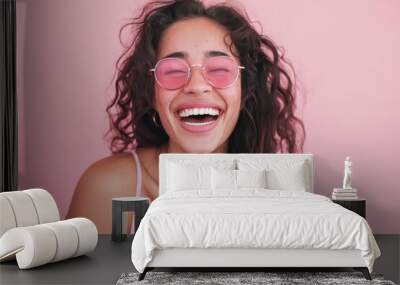 Cheerful Young Woman in Pink Round Sunglasses Posing for a Summer Portrait Wall mural