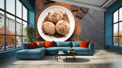 Chocolate ice cream on a black background Wall mural