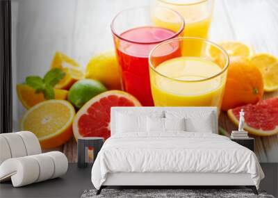 Glasses of juice and citrus fruits Wall mural