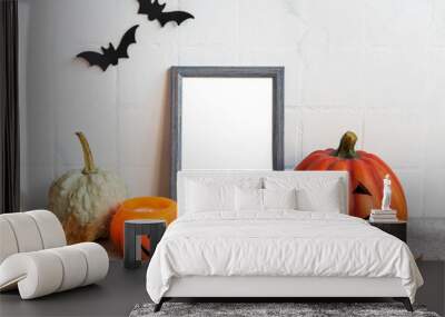 Mock up  frame with Jack o Lantern and pumpkin decor on a table. Wall mural