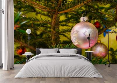 Beautiful colorful christmas decorations hanging on christmas tr Wall mural