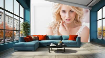 Close up portrait of young beautiful woman indoors Wall mural