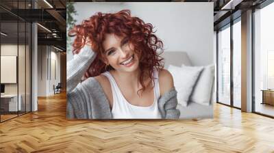 very attractive young woman close up portrait. beautiful female indoor. curly haired lady. red-haire Wall mural