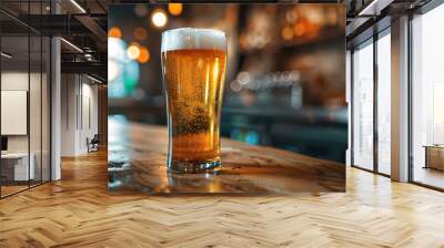 Mug with cold fresh golden beer on wooden table on blurred background. Craft beer on glass on Oktoberfest, international beer day and St. Patrick's day celebration in a pub or bar. Copy space. Wall mural