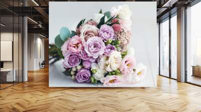 beautiful delicate flower bouquet with roses, ranunculuses, eustomas and carnations Wall mural