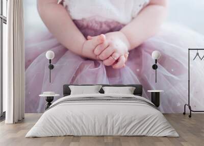 beautiful golden finger ring on the little hands of adorable toddler princess girl Wall mural