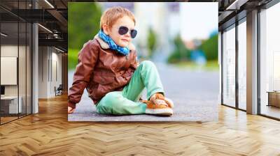 cute stylish boy in leather jacket sitting on the road Wall mural