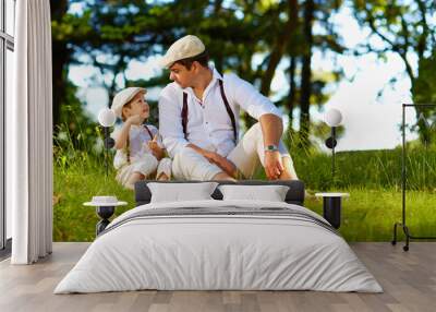 father and son having fun on forest lawn Wall mural