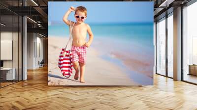 happy boy walking the summer beach Wall mural