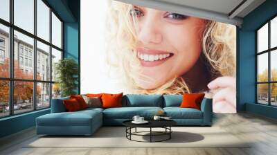 portrait of beautiful happy woman with curly hair and adorable smile Wall mural