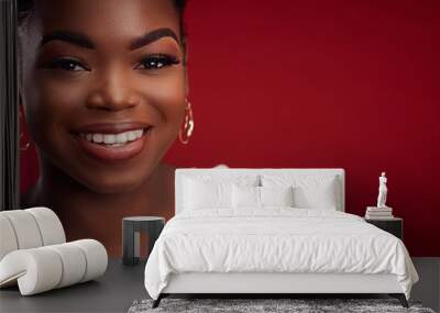 portrait of beautiful smiling african american woman on red background Wall mural