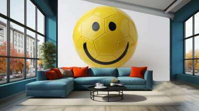 Yellow ball with smile face to play football on white background. Wall mural