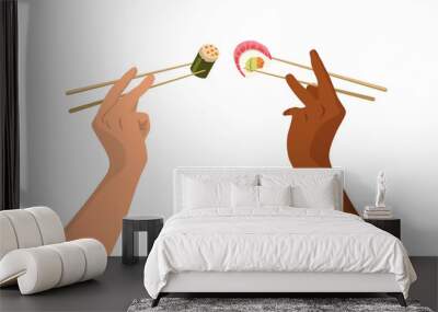 hands raised t hold in chopsticks rolls and sushi Wall mural