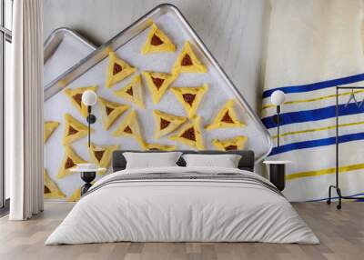 Raw triangle cookies on oven tray with tallit. Wall mural