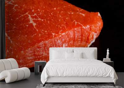 Uncooked marble beef tenderloin over black board. Wall mural