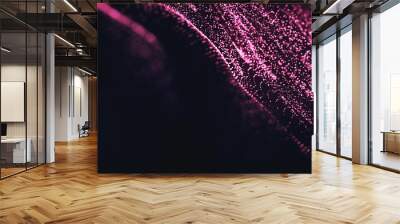 Abstract fairytale background and texture, pink and magenta tones.Thousand small glowing particles flying  black background Wall mural