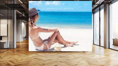 Beautiful woman in  bikini on tropical beach wih  white sand blue water. Vacation in paradise Wall mural