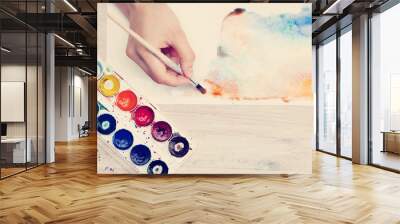 brush in the hands of the artist, watercolor painting, creativit Wall mural