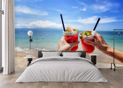 Fresh watermelon juice with a straw in two glasses against a bright tropical landscape, against the background of the sea. Vacation vacations healthy food concept Wall mural