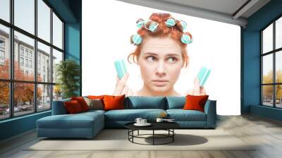 funny portrait of redheaded girl in hair curlers, isolated on wh Wall mural