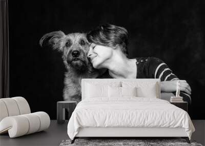 portrait of a beautiful young woman with a funny shaggy dog on a Wall mural