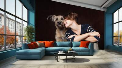 portrait of a beautiful young woman with a funny shaggy dog on a Wall mural