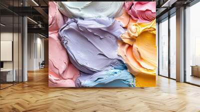   A close-up image showcases diverse shades of pink, yellow, blue, and green on a multicolored paint palette Wall mural