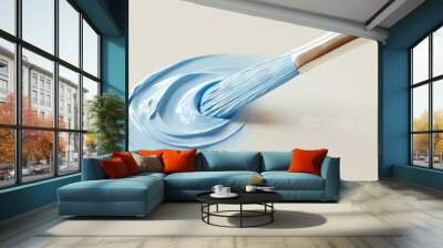   A close-up of a blue paintbrush with white paint on a white surface Wall mural