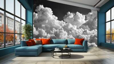  A grayscale picture of many clouds against a dark blue backdrop, taken from above Wall mural