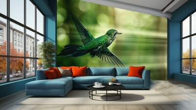   A green hummingbird flies gracefully with spread wings against a backdrop of trees Wall mural