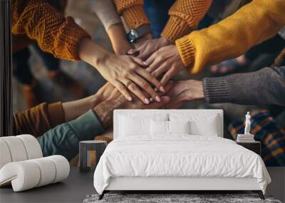  a group of people putting their hands together in the middle of a circle with their hands on top of each other. Wall mural