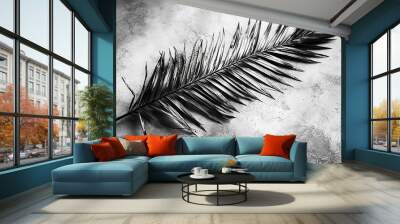   A monochromatic image of a palm leaf against a gray backdrop features two black and white photos of the same leaf Wall mural